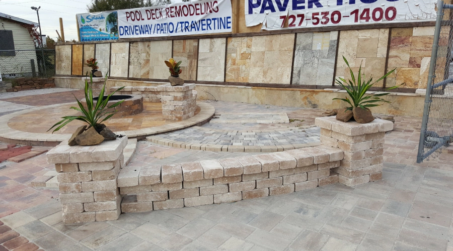 outdoor design of paver patio with fire place